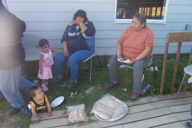 Brenda and her auntie Ina Kg. See the fish in front of them waiting to be cooked.