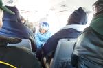 Inside the plane. Anita Kakegamic in blue