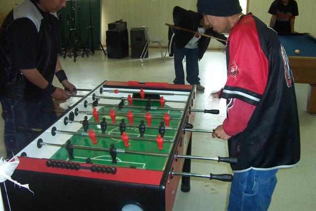Having a game of foozeball during the weekend afternoon.