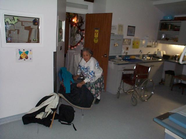 Here we are inside the X-ray room she is just getting ready to get her x-ray done.