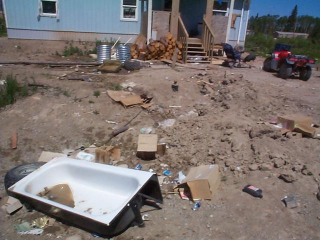 theres the old bathtub still by the side of the road waiting to be thrown out. and look at the yard still needs to be landscaped
