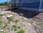 view of the front of the house, u see the boards covering the septic.