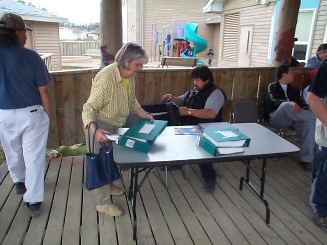 the Indian Affairs lady getting ready to set up table