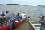 Dakota going for a canoe ride with Pastor David Fiddler and Eric