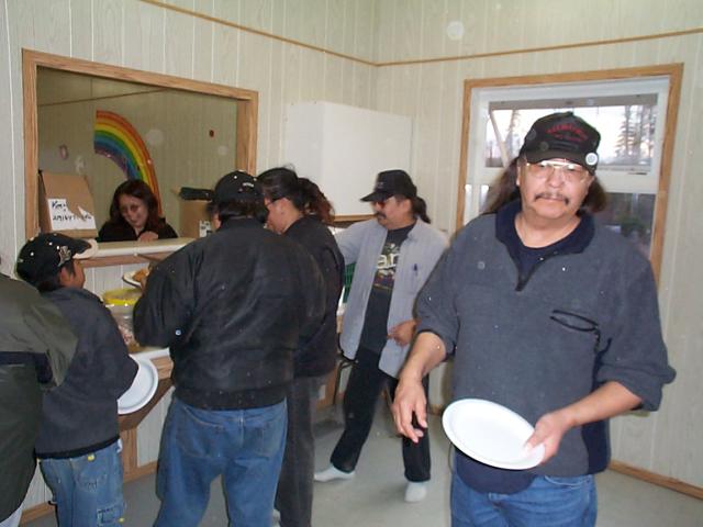 Lawrence Mason and behind him people in line for supper.