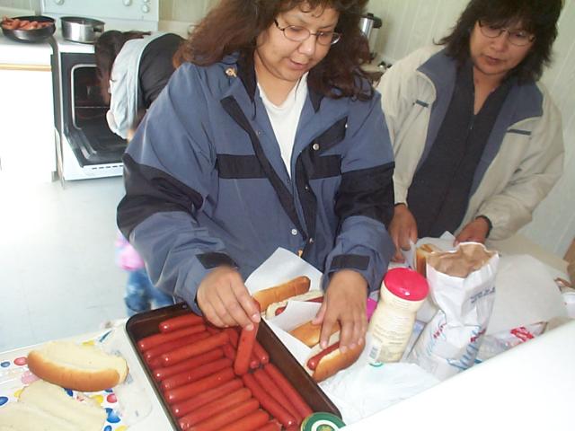 Brenda serving hotdogs