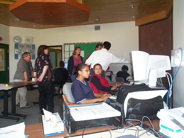 Another view of the internet high school in Keewaywin and a picture of some students working.
