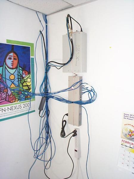 The WiLAN unit feeding the cable headend is at the top. The hub connecting the Bandoffice computers is below.