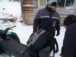 Peter Morriseau tying up here pack sack to the back of the skidoo. Alot of preparations is needed before you go on a long skidoo